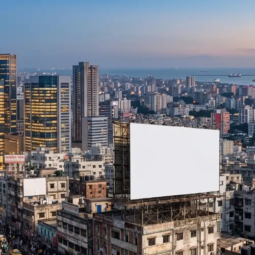 Blank billboard advertising board on top of a building in a modern city skyline during evening time.