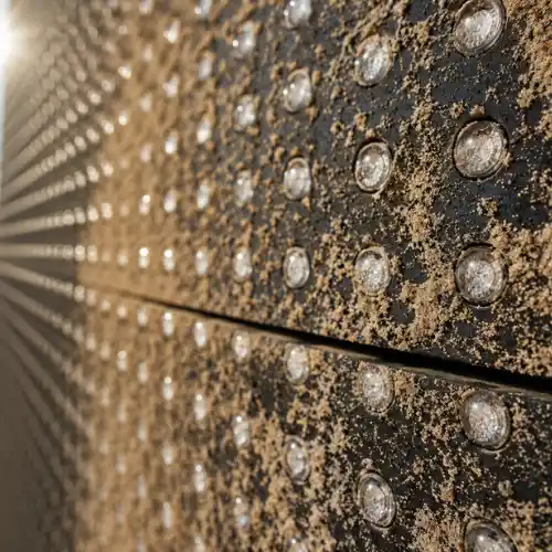 Outdoor LED screen supplier in Dubai showcasing a close-up of an LED display covered with fine desert sand and dust under harsh midday sunlight.